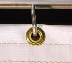 Brass Grommets used to hang industrial curtains securely on a rod.
